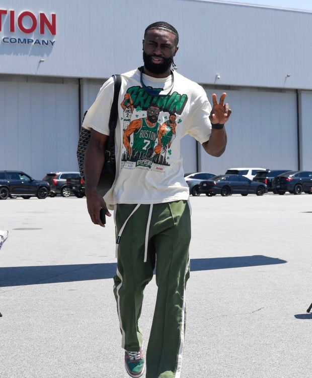Jaylen Brown walking and wearing a limited edition t-shirt of his likeness made by Planet Euphoria.